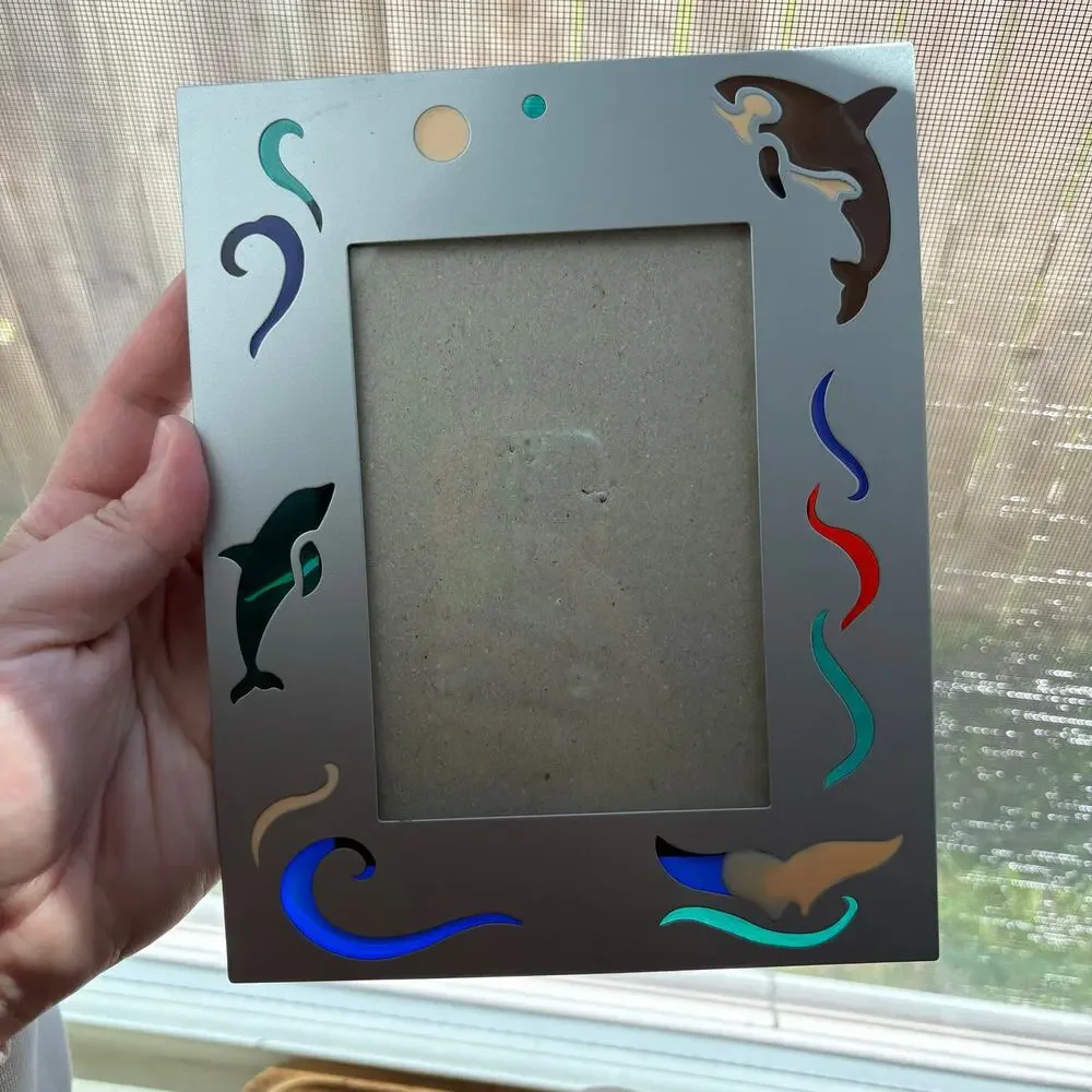 Vintage metal frame with dolphin and orca colorful designs